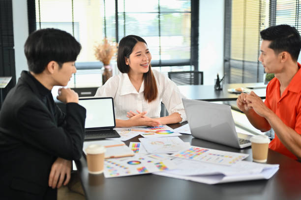 istock Interior designer team brainstorming, selecting colors for building and planning construction project together at office. 1633238007