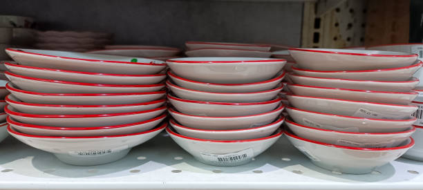 istock Several piles of plates neatly arranged on a shelf 1633257534