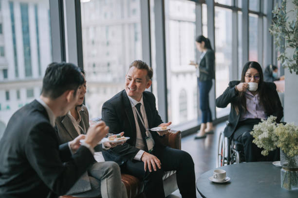 asian multiethnic business people talk during a coffee break in seminar business conference - board room business conference table window imagens e fotografias de stock