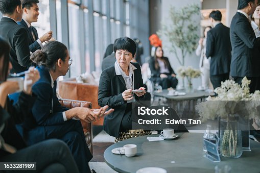 istock Group of multiracial Asian business participants casual chat during a coffee break in Seminar Business conference 1633281989