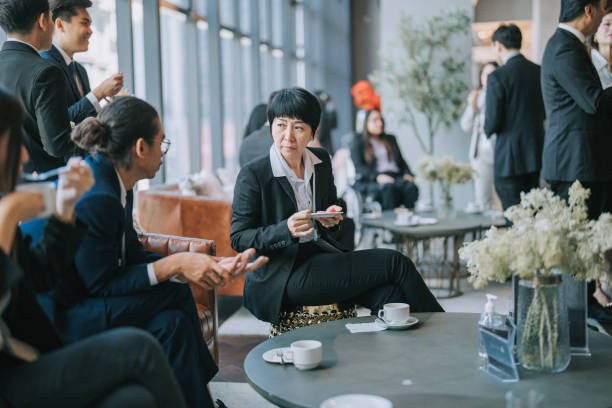 group of multiracial asian business participants casual chat during a coffee break in seminar business conference - board room business conference table window imagens e fotografias de stock