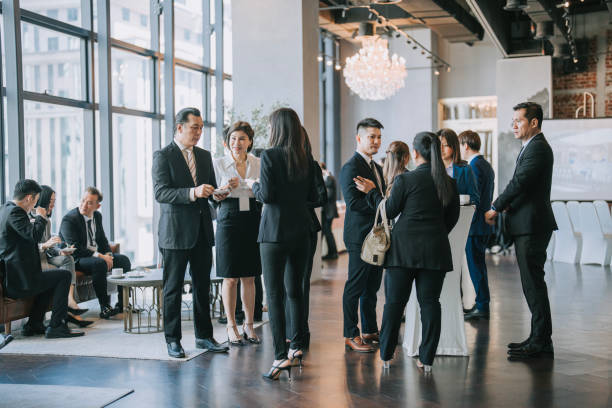 Group of multiracial Asian business participants casual chat after successful conference event Asian Multiethnic business people talk during a coffee break in Seminar Business conference corporate event  stock pictures, royalty-free photos & images