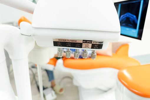 Closeup image of a modern dental water injection system in a dental clinic.