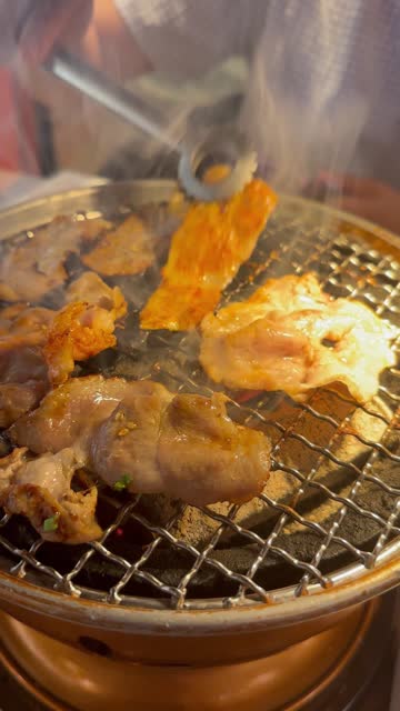 Grill BBQ pork and beef in the restaurant. Buffet barbecue of Korean style.