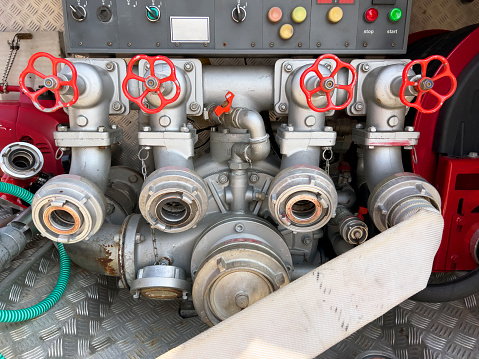 Close-up of a fire truck's many dials and mechanism for fighting fires