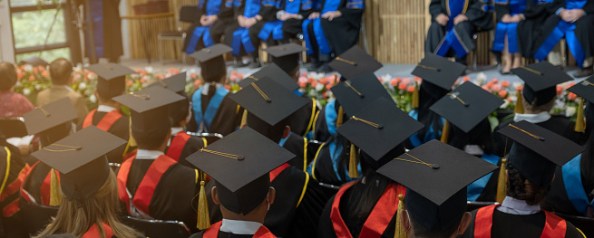 A large group of University graduation degree caps during ceremonies on commencement day.