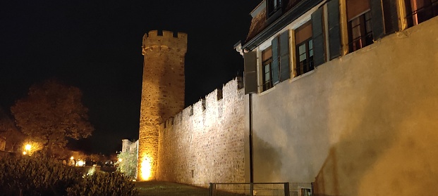 Image of the walls of Obernai illuminated at night during December 2022