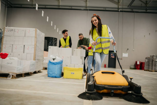 istock Woman cleaning a warehouse 1633369240