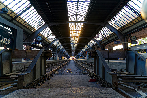 Diminishing perspective of railway tracks at main railway station of City of Zürich on a late spring evening. Photo taken June 7th, 2023, Zurich, Switzerland.