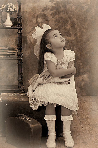 istock Little girl looking away in thought 163342675