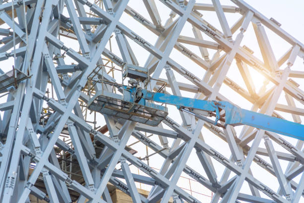 istock Metal frame lattice building decoration, with tower lift and cradle. 1633444312