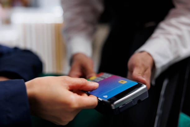 istock Person using credit card for payment 1633446426
