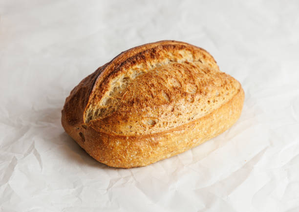 Baked loaf of bread with beautiful cut crust