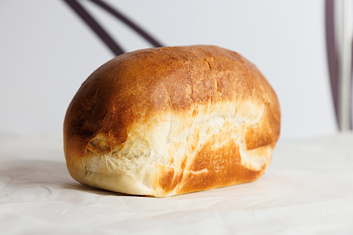 Beautifully baked bread with yellowish brown glazed crust