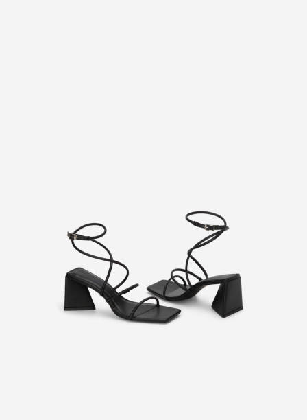 istock high heel sandals isolated on white background 1633463141