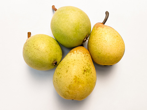Fresh organic pears on white background