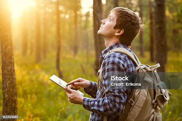 Man Using Digital Tablet In The Nature In A Sunny Day Stock Photo - Download Image Now