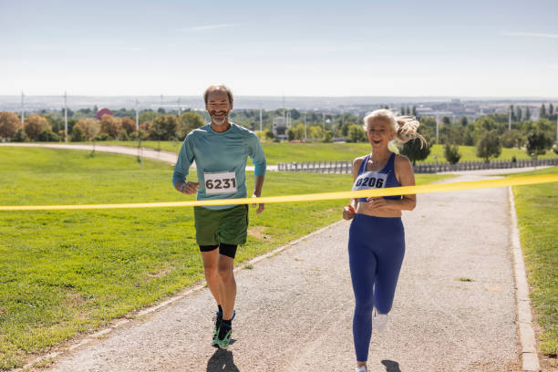 istock senior people running marathon with bibs reaching the finish line 1633525982