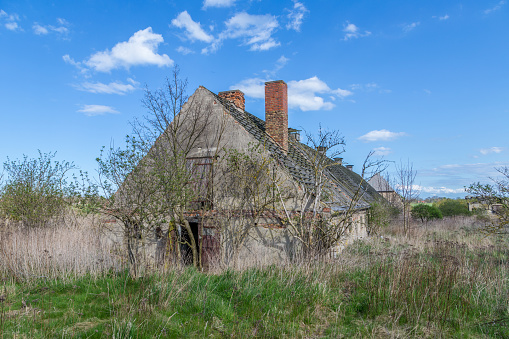 old rotten house in the field in Usedom, Germany