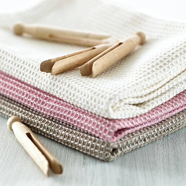 Clothespins on a tea towel stock photo