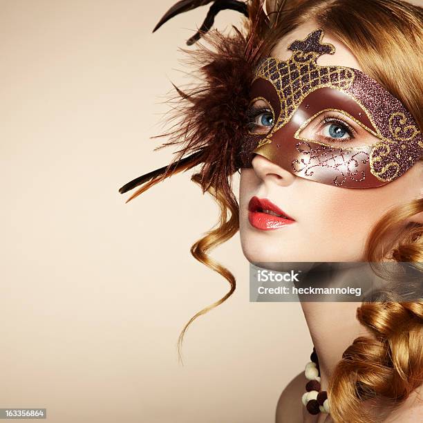 Beautiful Young Woman In Brown Mysterious Venetian Mask Stock Photo - Download Image Now