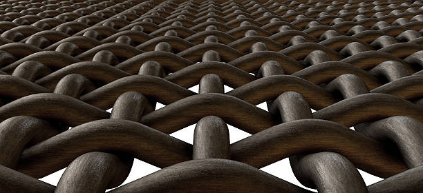 A closeup of a woven metal barbeque grating on a white background