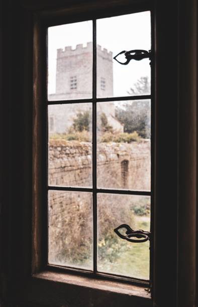 istock Stunning view of a majestic old castle from a window. 1633576205
