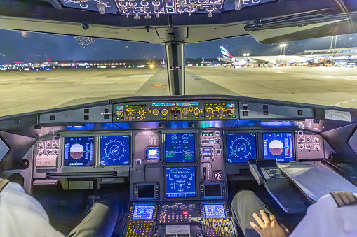 Frankfurt, Germany -October 9, 2014: landing by night with a commercaial aircraft A320 at the airport of Frankfurt, Germany.