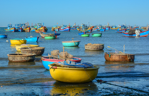 View of the tidal inlet to the harbour and quay in the north Norfolk village of Blakeney, UK.