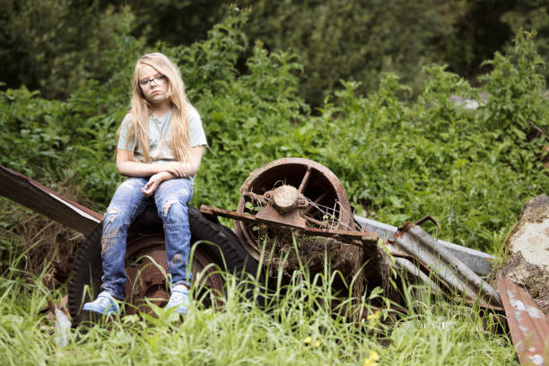 istock Scruffy vagabond girl looking distinctly unfriendly and miserable 1633621127