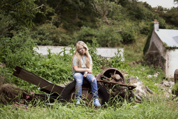 istock Scruffy vagabond girl looking distinctly unfriendly and miserable 1633623302