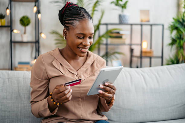 istock Young Woman Shopping Online At Home Using Digital Tablet 1633624916