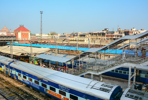 Agra, India - Jul 13, 2015. Indian Railways train stopping at station in Agra, India. Indian Railways carried 8.4 billion passengers annually or more than 23 million passengers daily.