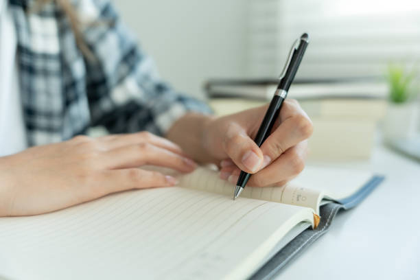istock Student, use left-handed, inspiration, writer, writing ,creative ,recreation for imagine, writing ideas on notebook, to do list, good thinking work, journalist, Stylish, Dream image, relax, designer 1633634039