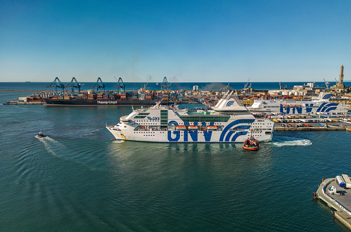 Genoa, Italy- August 7,2023: The drone aerial view of Genoa port and GNV ferry ships.  Grandi Navi Veloci （GNV） is an Italian shipping company, based in Genoa