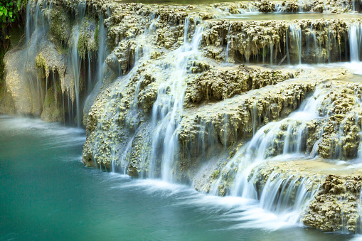 Krushuna waterfalls turquoise water terraces and pools, the biggest travertine cascade in Bulgaria