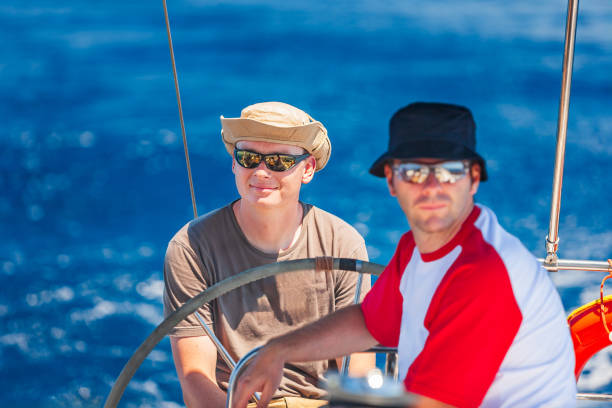 istock Crew members enjoying sailing on sailboat 1633666355