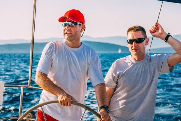 istock Crew members enjoying sailing on sailboat 1633666955