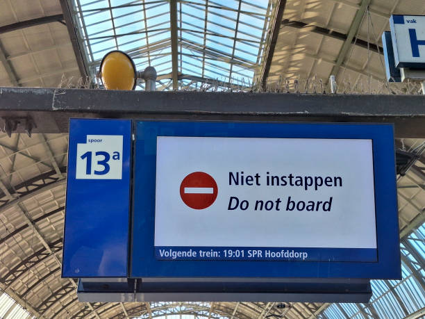 A sign Niet instappen or do not board at a train station in the netherlands A sign Niet instappen or do not board at a train station in the netherlands shown on platform instappen stock pictures, royalty-free photos & images