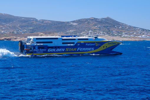 Cyclades, GR - 30 July 2023: Ferry boat in the Cyclades on the Aegean Sea