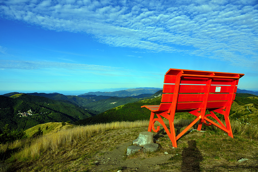 big bench and panorama from the path to monte antola liguria italy