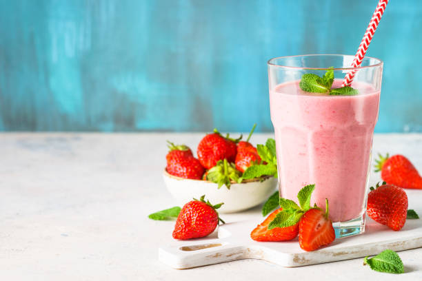 istock Strawberry smoothie or milkshake on white. 1633768881