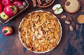 Apple pie on a wooden background, selective focus