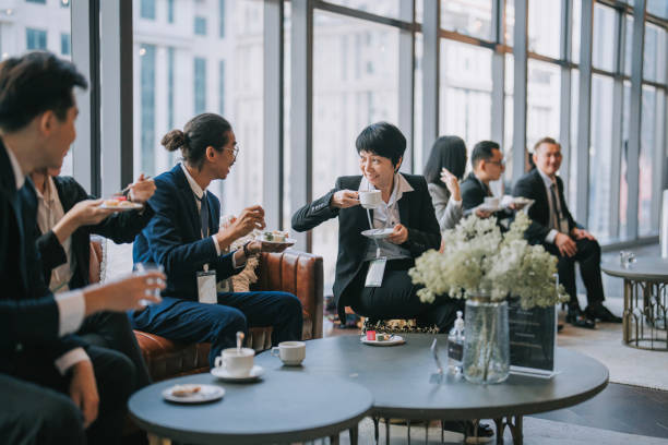 group of multiracial asian business participants casual chat coffee break conference event - board room business conference table window imagens e fotografias de stock