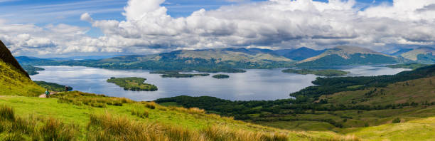 istock Panoramic view of a beautifil Scottish Loch and mountain range (Loch Lomond, Highlands) 1633781036
