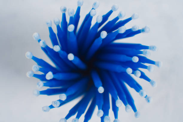 istock View from above of bunch of professional microbrushes, using for eyelash extension procedure, lying in container. 1633784954