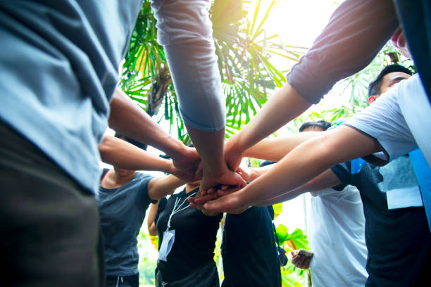 istock Unity strong handshake with people or agreement of feeling or happy team working together 1633794686