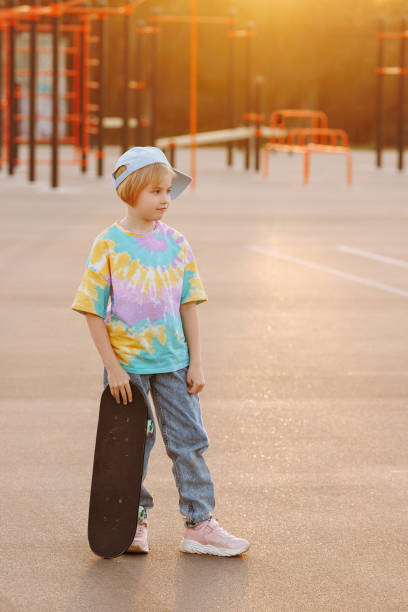 istock Little girl with skateboard 1633797928