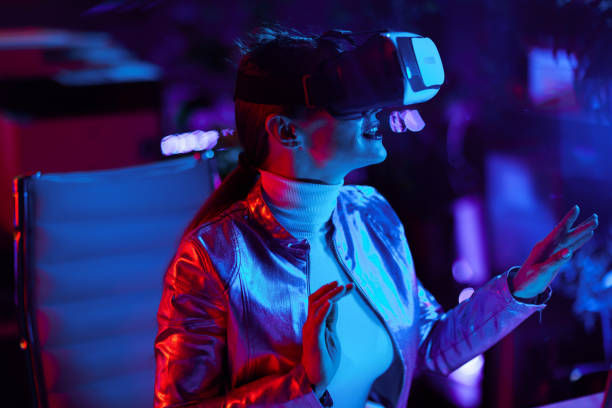 istock smiling elegant woman in virtual reality goggles in office 1633802031