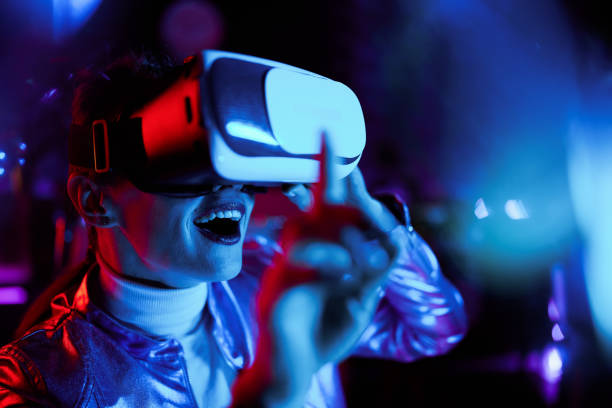 istock excited elegant woman in vr headset testing out virtual reality 1633802564